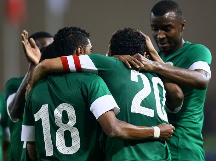 Saudi Arabia's players celebrate after Yasser al-Qahtani scored a goal against Yemen during their 21st Gulf Cup football match in the Bahraini capital Manama on January 9, 2013. AFP PHOTO/MARWAN NAAMANI