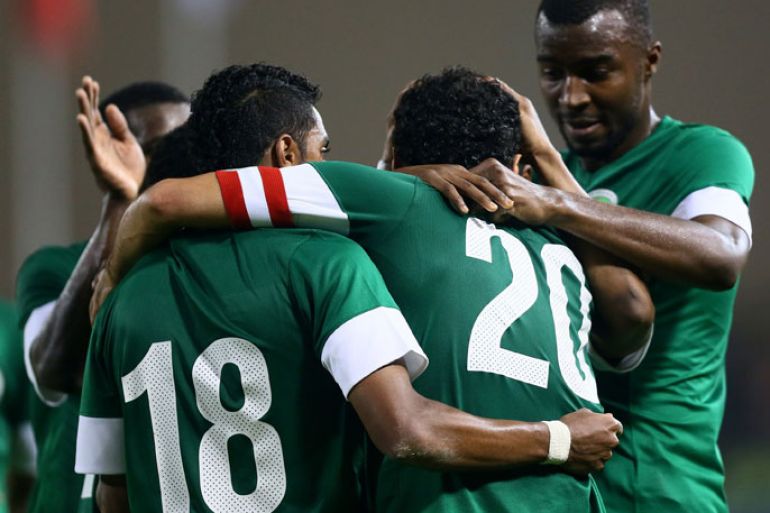 Saudi Arabia's players celebrate after Yasser al-Qahtani scored a goal against Yemen during their 21st Gulf Cup football match in the Bahraini capital Manama on January 9, 2013. AFP PHOTO/MARWAN NAAMANI