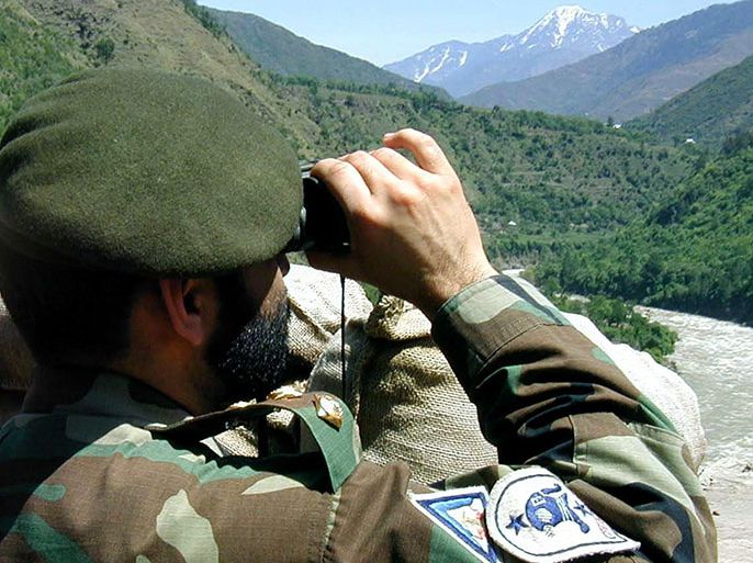 A Pakistani soldier keeps watch over to the Indian army positions at the disputed frontier between two countries also know as Line of Control (LOC) in the Chakothi sector, Muzaffarabad, Kashmir on 5 May 2003 . Kashmir is a land of dispute between Pakistan and India. The international community fears that the dispute between India and Pakistan could lead to nuclear confrontation, and has pressed the two to hold peace talks. Both countries have nuclear arsenals and on Monday, 5 May 2003, a Pakistani official said that 'Pakistan will dispose of its nuclear arsenal if rival India does as well.'