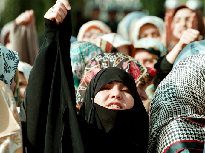 IST03-19981106-ISTANBUL, TURKEY : A young veiled Turkish woman shouts slogans supporting the wearing of headscarves by female university students at an Islamic demonstration at Istanbul University, at Beyazit, Istanbul, 06 November 1998. Today was the 18th anniversary of the creation of the Student Advisory Board, who are the people who have banned headscarves on the Istanbul University Medical Campus.