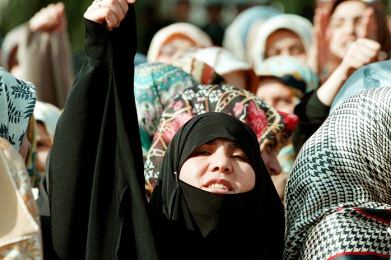 IST03-19981106-ISTANBUL, TURKEY : A young veiled Turkish woman shouts slogans supporting the wearing of headscarves by female university students at an Islamic demonstration at Istanbul University, at Beyazit, Istanbul, 06 November 1998. Today was the 18th anniversary of the creation of the Student Advisory Board, who are the people who have banned headscarves on the Istanbul University Medical Campus.
