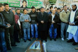 Members of the Pakistani community in Greece pray over the coffin of the 27-years old Pakistani national Shehzad Luqman who was stabbed to death on 17 January by two suspected ultra right wing Greeks in Athens, Greece, 19 January 2013. Anti-racist movements have called an anti-racist demonstration in Athens on Saturday afternoon