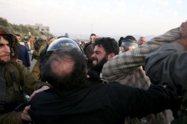 Israeli security forces apprehend a Palestinian demonstrator during a protest in Anin village in the West Bank near Jenin city, on January 26, 2013