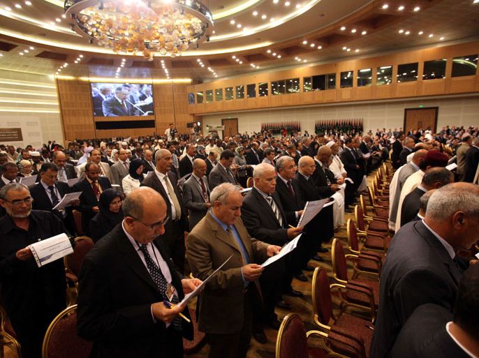 epa03351667 Members of the National Congress of Libya during the transfer of authority ceremony in Tripoli, Libya, early 09 August 2012. Libya's National Transitional Council transferred power to the recently elected National Congress, nearly a year after the ousting of Libyan leader Moamer Gaddafi. The ceremony started shortly after midnight with a moment of silence for those who fell during Libya's uprising, followed by a speech by the head of the NTC, Mustapha Abdel Jalil, who called it a historical moment in the history of Libya. EPA/SABRI ELMHEDWI
