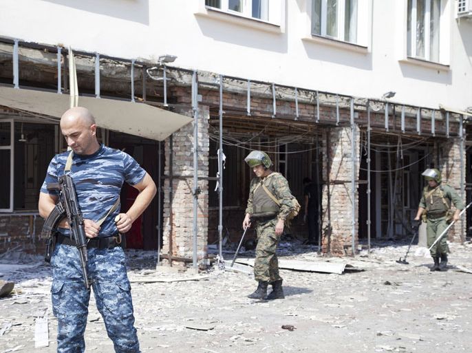 • Sappers work at the scene of a suicide bomb attack in Grozny August 31, 2011. Three suicide bombers were responsible for killing at least eight people in the capital of Russia's Chechnya region, a police official in the North Caucasus province said on Wednesday.