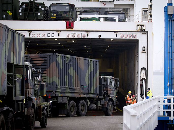 A ship is loaded with Dutch Patriot defence missiles in the Eemshaven (Eems harbor) in Groningen, The Netherlands, on January 8, 2013. The missiles will be shipped to Turkey where they are to be used to protect the country from possible attacks from neighbouring Syria. The Turkish request came after repeated cross-border shelling from Syria, including an October attack that killed five civilians. The Dutch Patriots and support troops will be tasked with defending the city of Adana, population 1.5 million, which lies around 100 kilometres (over 60 miles) from Syria. AFP PHOTO / ANP / EVERT-JAN DANIELS -- The Netherlands out --