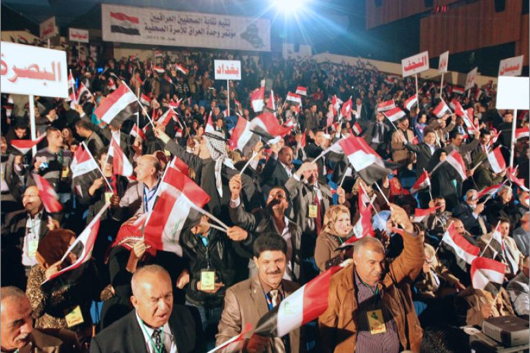 Iraqi journalists from across the national provinces gather at the National Theater in Baghdad during a conference calling on national unity and rejecting the sectarian and political division plaguing the country, on January 26, 2013