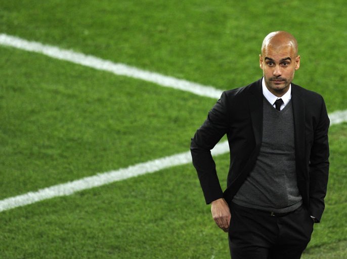 (FILES) A photo taken on April 24, 2012 shows Barcelona's coach Josep Guardiola looks on during the UEFA Champions League second leg semi-final football match Barcelona against Chelsea at the Cam Nou stadium in Barcelona . Former Barcelona manager Pep Guardiola will take over as Bayern Munich head coach for the 2013/14 season, the Bundesliga giants confirmed on January 16, 2013, with the Spaniard offered a contract until 2016.