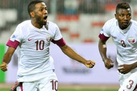 Qatar's Khalfan Ibrahim (L) celebrates his goal with teammate Kasola Mohammed during their Gulf Cup tournament soccer match against Oman at Isa Sports City in Isa Town January 8, 2013. REUTERS/Tariq AlAli (BAHRAIN - Tags: SPORT SOCCER)