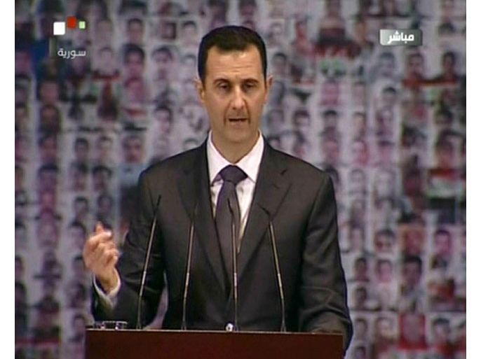 An image grab taken from the state-run Syrian TV shows Syria's embattled President Bashar al-Assad making a public address on the latest developments in the country and the region on January 6, 2013. The speech marks the first time the head of state, who has faced nearly two years of a popular revolt turned civil war, has made a public address since June. AFP PHOTO/SYRIAN TV