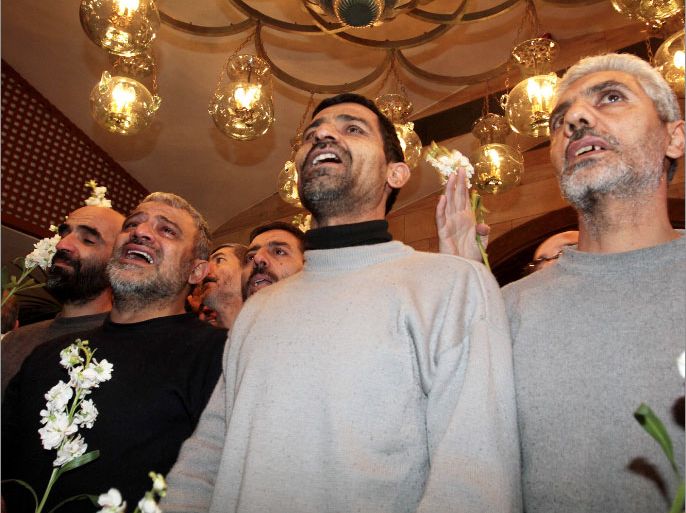 Iranian men who had been held hostage by Syrian rebels since early August arrive at a hotel in Damascus after being freed in a prisoner swap on January 9, 2013. A total of 48 Iranians were released in the unprecedented exchange for 2,130 prisoners detained by President Bashar al-Assad's regime, according to several sources. AFP PHOTO/LOUAI BESHARA
