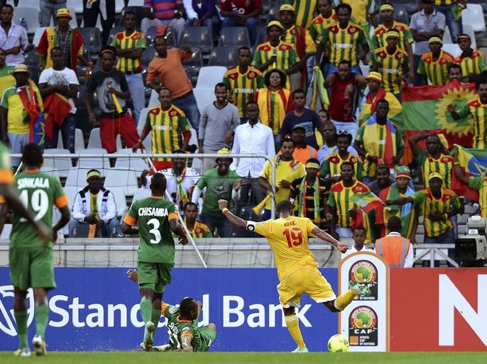 Ethiopia's Girma Gebrayes (R) kicks the ball to score a goal during the CAN2013 Zambia vs Ethiopia group C football match at Mbombela Stadium in Nelspruit on January 21, 2013. AFP PHOTO/ FRANCISCO LEONG