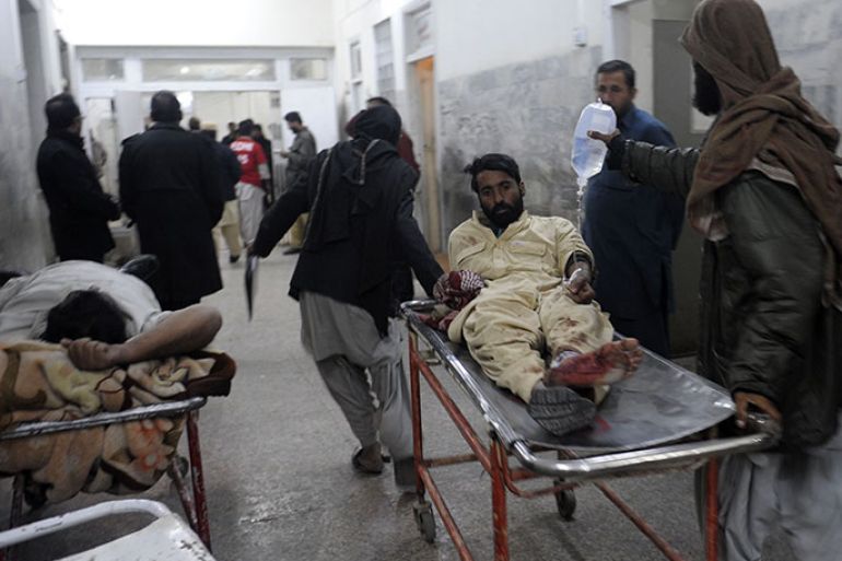 Pakistani men shift an injured train passenger at a hospital after an attack on the Jaffar Express train, in Quetta on early 6, 2012. Unidentified gunmen fired at a train in Pakistan’s restive Baluchistan province, killing at least five people and injuring 20 others. AFP PHOTO/Banaras KHAN