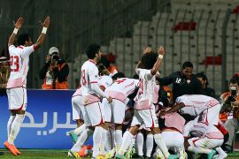 United Arab Emirates players celebrate after scoring the second goal against Bahrain during their match in the 21st Gulf Cup in Manama, on January 8, 2013. The Emiartes won 2-1. AFP PHOTO/MARWAN NAAMANI