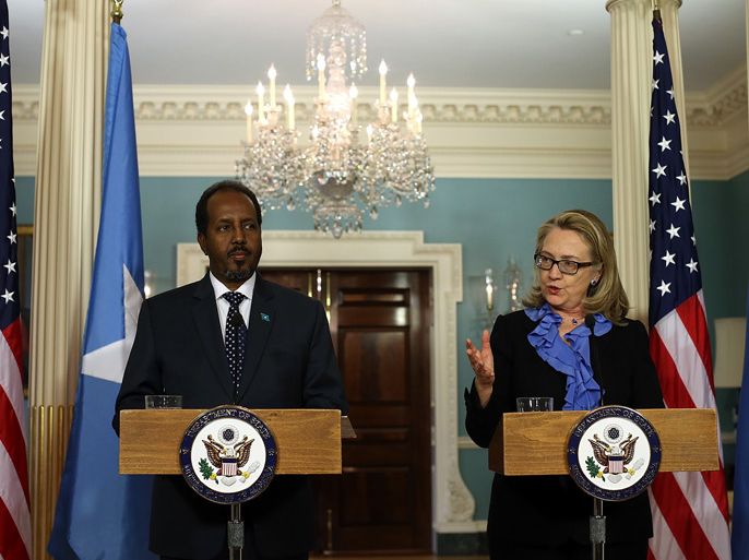 JANUARY 17: Secretary of State Hillary Clinton (R) speaks as Somali president Hassan Sheikh Mohamud speaks during a news conference on January 17, 2013 in Washington, DC. Secretary Clinton announced that the United States would recognize the Somali government for the first time in over 20 years, since the shooting down in Mogadishu of two American Black Hawk helicopters. Justin