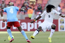 Ghana's midfielder Derek Boateng (R) vies for the ball with Democratic Republic of Congo's forward Patou Kabangu during their 2013 African Cup of Nations football match