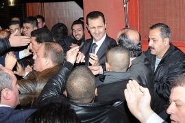 Syria's President Bashar al-Assad (C) speaks to his supporters after speaking at the Opera House in Damascus January 6, 2013, in this handout photograph released by Syria's national news agency SANA. A defiant al-Assad presented what he described as a new initiative on Sunday to end the war in Syria but his opponents dismissed it as a ploy to cling to power. REUTERS/Sana (SYRIA - Tags: POLITICS) FOR EDITORIAL USE ONLY. NOT FOR SALE FOR MARKETING OR ADVERTISING CAMPAIGNS. THIS IMAGE HAS BEEN SUPPLIED BY A THIRD PARTY. IT IS DISTRIBUTED, EXACTLY AS RECEIVED BY REUTERS, AS A SERVICE TO CLIENTS