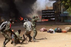 Malian soldiers fight while clashes erupted in the city of Gao on February 21, 2013 and an apparent car bomb struck near a camp housing French troops as Malian and foreign forces struggled to secure Mali's volatile north against Islamist rebels.
