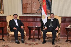 Egyptian President Mohamed Mursi (R), meets with Iran's President Mahmoud Ahmadinejad after he arrived at International Airport in Cairo in this photo provided by the Egyptian Presidency on February 5, 2013. Ahmadinejad arrived in Egypt on Tuesday on the first trip by an Iranian head of state since the 1979 revolution, underlining the thaw in relations since Egyptians elected an Islamist head of state. REUTERS/Egyptian Presidency/Handout (EGYPT - Tags: POLITICS TPX IMAGES OF THE DAY) ATTENTION EDITORS - THIS IMAGE WAS PROVIDED BY A THIRD PARTY. FOR EDITORIAL USE ONLY. NOT FOR SALE FOR MARKETING OR ADVERTISING CAMPAIGNS. THIS PICTURE IS DISTRIBUTED EXACTLY AS RECEIVED BY REUTERS, AS A SERVICE TO CLIENTS