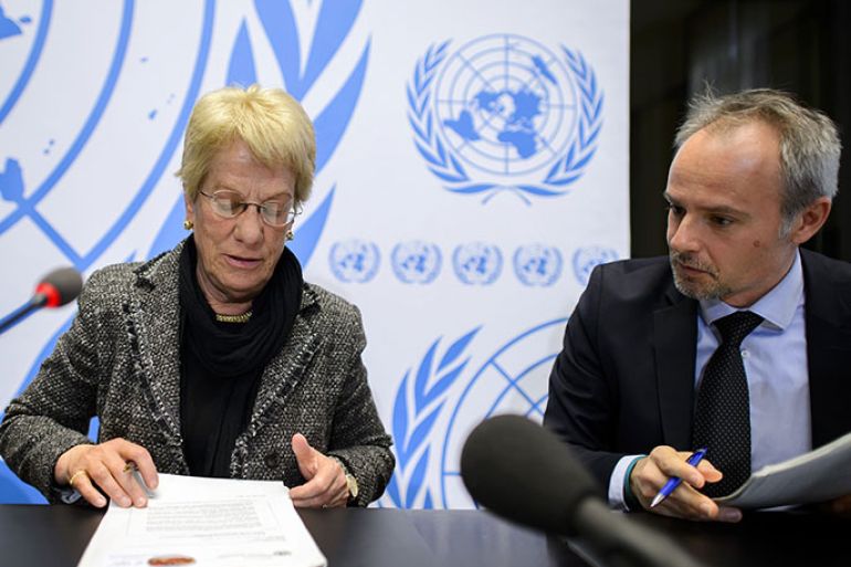 Former United Nations (UN) prosecutor and member of a UN-mandated commission of inquiry on the Syria conflict, Swiss Carla del Ponte (L) looks her document next to spokesperson of Human Rights Council, Rolando Gomez during a press conference on February 18, 2013 in Geneva. The International Criminal Court should be called in to probe war crimes in Syria, former UN prosecutor Carla del Ponte said. AFP PHOTO / FABRICE COFFRINI