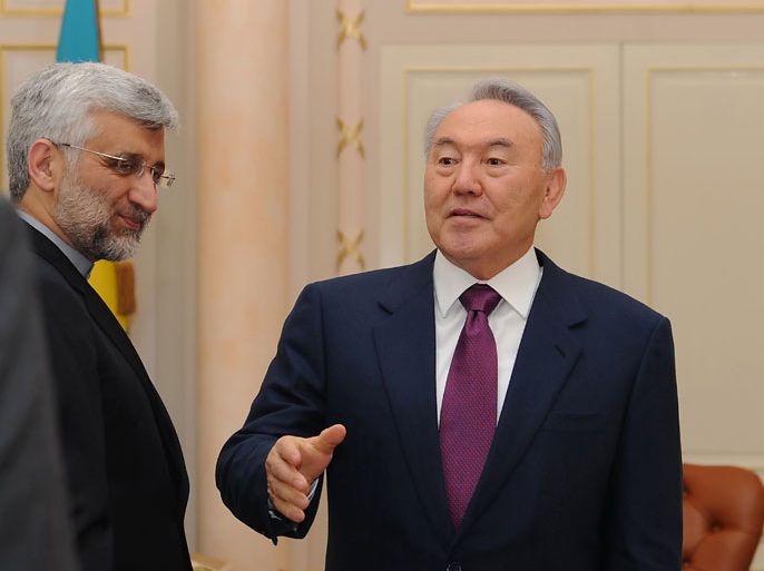 Kazakhstan's President Nursultan Nazarbayev (R) welcomes Iran's top nuclear negotiator Saeed Jalili (L) in the Kazakh city of Almaty, on February 25, 2013. World powers meet negotiators from Iran in the Kazakh city of Almaty tomorrow in the hope of curbing