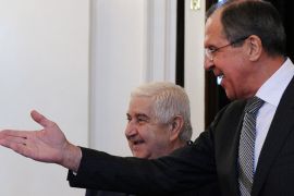 Russian Foreign Minister Sergei Lavrov (R) speaks with his Syrian counterpart Walid al-Muallem during their meeting in Moscow on February 25, 2013. The regime of Syrian President Bashar al-Assad is ready to talk with all parties, including armed groups, who want dialogue to end the conflict, Walid al-Muallem said today at the start of talks with Lavrov.