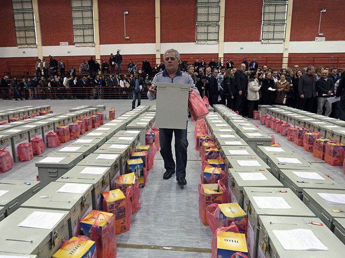 epa03584915 Ballot boxes are lined up at an indoor sports stadium in Nicosia, Cyprus, 15 February 2013.