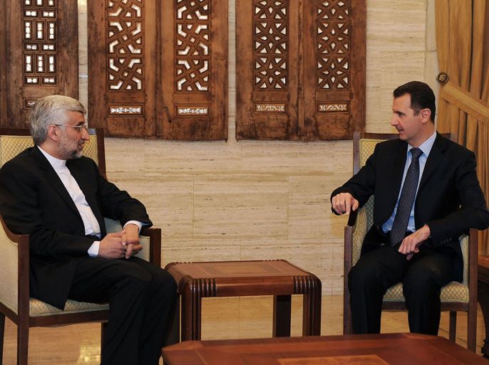 DAM1393 - Damascus, -, SYRIA : A handout picture released by the official Syrian Arab News Agency (SANA) on February 3, 2013, shows Syrian president Bashar al-Assad talking with Saeed Jalili, who heads the Iranian Supreme National Security Council in Damascus. "We will give all our support so that Syria remains firm and able to face all the arrogant (Western) conspiracies," said Saeed Jalili. AFP PHOTO / HO-SANA --- RESTRICTED TO EDITORIAL USE - MANDATORY CREDIT "AFP PHOTO/HO/SANA" - NO MARKETING - NO ADVERTISING CAMPAIGNS - DISTRIBUTED AS A SERVICE TO CLIENTS