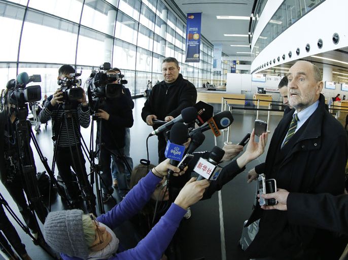 IAEA (International Atomic Energy Agency) Deputy Director General and Head of the Department of Safeguards Herman Nackaerts (C) talks with journalists as he leaves for another trip with his team to Iran on February 12, 2013 at the Airport Schwechat, near Vienna, Austria. Iran hinted that inspection of the Parchin military site by the International Atomic Energy Agency would be possible in the context of a "comprehensive agreement" that recongnises its right to peaceful nuclear energy. AFP PHOTO / DIETER NAGL
