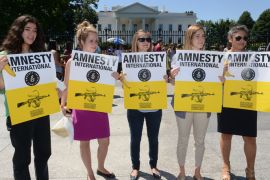 epa03317513 Amnesty International activists hold bananas and signs calling on the US to lead the international community to finalize a strong global Arms Trade Treaty (ATT), outside the North Lawn of the White House in Washington DC, USA, 25 July 2012. Activists claim the banana trade is more tightly regulated than the arms trade. Amnesty has collected nearly sixty thousand signatures of petitioners urging the ban of exports of conventional arms and ammunition to countries and militias that use them to commit genocide and other serious violations of human rights. Delegates from more than one hundred and fifty nations gathered at the UN in New York have just three days to reach consensus on final treaty language before the ATT conference concludes 27 July 2012. EPA/MICHAEL REYNOLDS