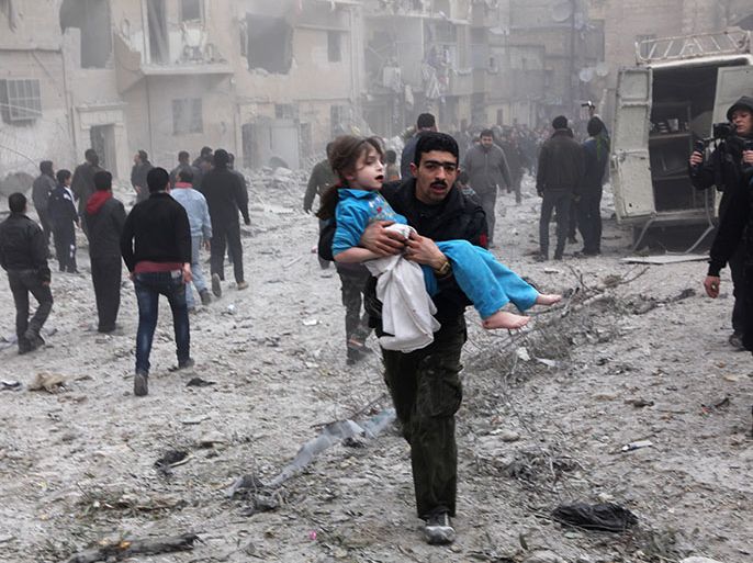 epa03566513 A man holds a child in his arms in Aleppo, Syria, 03 February 2013. An airstrike on 03 February destroyed a house and killed and injured several people. EPA/THOMAS RASSLOFF
