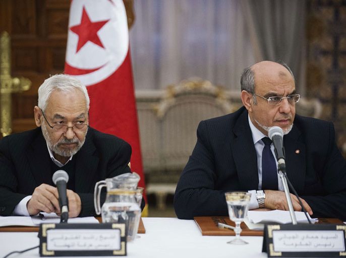 Tunisian Islamist Ennahda party president Rached Ghannouchi (L) and Prime Minister Hamadi Jebali listen during a round of consultations with other political parties at the Prime Minister guest house in Carthage, Tunisia on February 15, 2013. Jebali was consulting with a raft of party leaders as he hammered out a government of technocrats designed to pull Tunisia out of its worst political crisis since the revolution. AFP PHOTO/GIANLUIGI GUERCIA