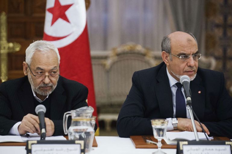 Tunisian Islamist Ennahda party president Rached Ghannouchi (L) and Prime Minister Hamadi Jebali listen during a round of consultations with other political parties at the Prime Minister guest house in Carthage, Tunisia on February 15, 2013. Jebali was consulting with a raft of party leaders as he hammered out a government of technocrats designed to pull Tunisia out of its worst political crisis since the revolution. AFP PHOTO/GIANLUIGI GUERCIA