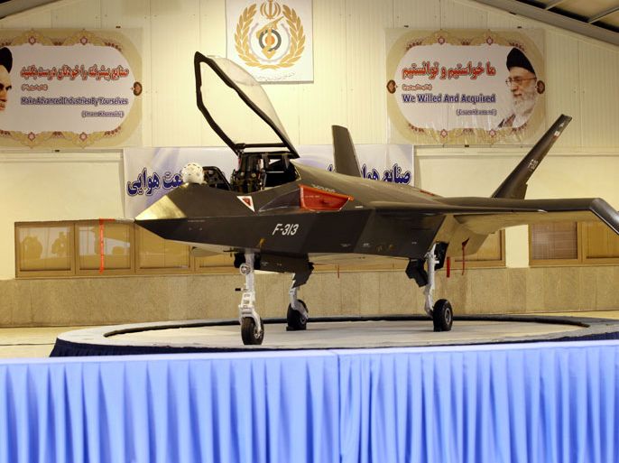 BEH005 - Tehran, -, IRAN : Iran's domestically designed and built Qaher (Conqueror) F-313 fighter jet is unveiled during a ceremony in a warehouse in Tehran on February 2, 2013. Iran unveiled the grey, futuristic-looking fighter jet, with President Mahmoud Ahmadinejad touting it as "one of the most advanced" aircraft in the world. AFP PHOTO/MEHR NEWS/YOUNES KHANI