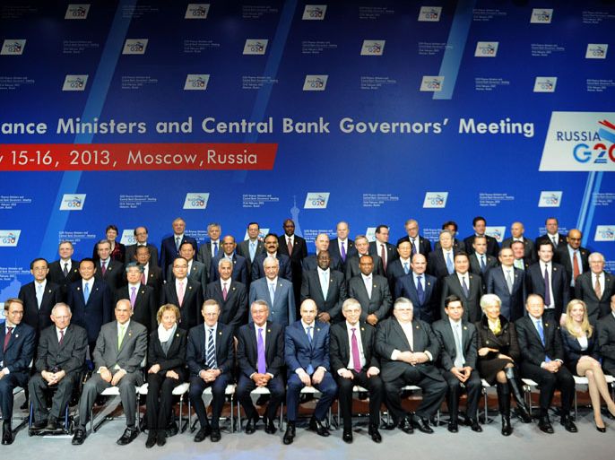 : Participants of G20 states finance ministers and central bank governors meeting pose for family picture in Moscow, on February 16, 2013. The ministers and central bank governors gathered today in Moscow for their first meeting in the Russian capital aimed at reassuring markets that the world's economic powers would not slug it out in "currency wars" to boost national growth. AFP HOTO