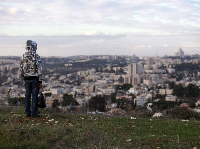 epa03514744 A photograph released on 20 December 2012 shows a Palestinian overlooking greater Jerusalem as he stands watching his flock as it grazes on the area of Givat Hamatos, in southern Jerusalem, 19 December 2012, where Israel says thousands of new housing units will be built. The UN Security Council is criticizing Israel and demanding an immediate halt to new settlement construction both here and in the area called E1. Israel lashed out at the Palestinian authority by announcing thousands of new housing units in Jerusalem and Jewish settlements immediately after the Palestinians gained nonmember observer status in the UN. EPA/JIM HOLLANDER