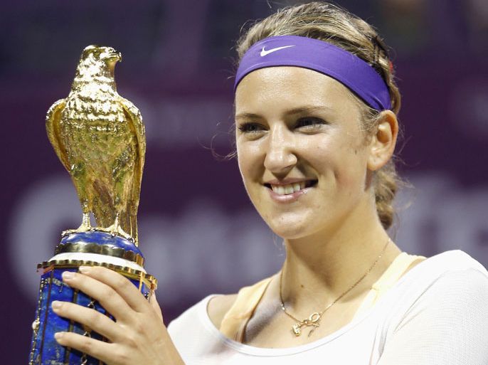 Victoria Azarenka of Belarus holds her trophy after defeating Serena Williams of the U.S. during the final match at the Qatar Open tennis tournament in Doha February 17, 2013. Outgoing world number one Victoria Azarenka showed that being second best was not an option for her as she outclassed Serena Williams 7-6 2-6 6-3 to win the Qatar Open on Sunday. REUTERS/Fadi Al-Assaad (QATAR - Tags: SPORT TENNIS)
