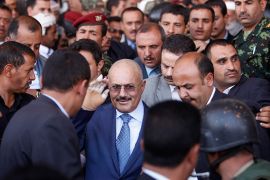 Yemen's former President Ali Abdullah Saleh gestures as he arrives to a rally in Sanaa February 27, 2013. The rally was held by Saleh's supporters to mark the first anniversary of his power transfer. REUTERS/Khaled Abdullah (YEMEN - Tags: POLITICS CIVIL UNREST ANNIVERSARY)