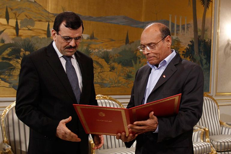 Tunisian President Moncef Marzouki (R) meets with prime minister-designate Ali Larayedh in Tunis February 22, 2013. Marzouki on Friday asked Interior Minister Ali Larayedh, a hardliner from the Ennahda party, to form a government within two weeks, his spokesman said. REUTERS/Zoubeir Souissi (TUNISIA - Tags: POLITICS)