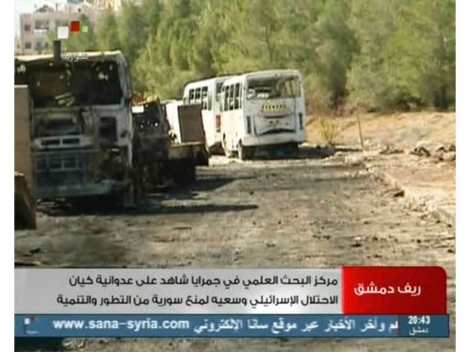 Damascus, -, SYRIA : An image grab taken from the state-run Syrian TV on February 2, 2013, shows damaged vehicles after what Syria said was an Israeli air raid which targeted the Jamraya scientific research base on the outskirts of Damascus on February 1. According to a US official who spoke on condition anonymity, the Israeli raid targeted surface-to-air missiles on vehicles and an adjacent military complex suspected of housing chemical agents. AFP PHOTO/SYRIAN TV == RESTRICTED TO EDITORIAL USE - MANDATORY CREDIT "AFP PHOTO/SYRIAN TV - NO MARKETING NO ADVERTISING CAMPAIGNS - DISTRIBUTED AS A SERVICE TO CLIENTS ==