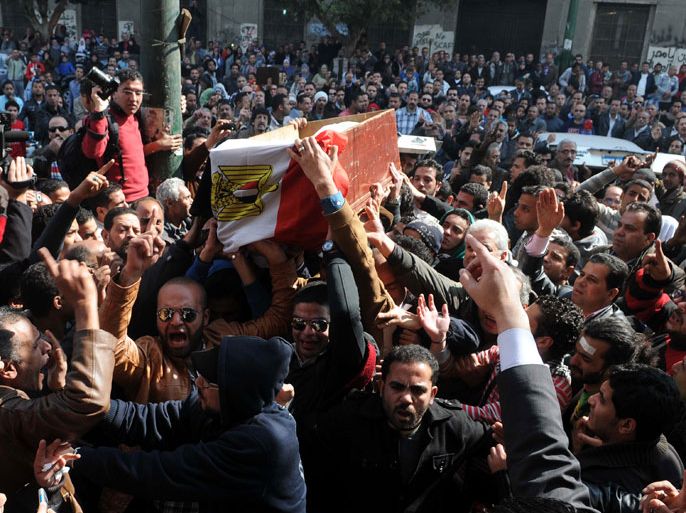 Egyptian mourners carry the coffin of one of the activists allegedly killed in recent clashes, during their funeral in Cairo, Egypt, 04 February 2013. According to media sources, the Egyptian presidency had called for investigation into activist Mohamed al-Gindy’s death, after allegations he was tortured in police custody. Al-Gindy and the other activist Amr Saad died on 04 February in Cairo hospitals. Their deaths come amid increasing public anger against police brutality during last week's clashes, in which more than 60 people died across the country. The Interior Ministry said 396 policemen have been injured in these protests