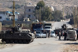Lebanese soldiers of the airborne division check vehicles in the east Lebanon village of Arsal, near the Syrian border on February 4, 2013. Lebanon's army chief Jean Kahwaji has warned that the military will "pursue" anyone who attacks it, after two troops were killed in a clash with Islamists in Arsal on February