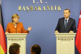 German Chancellor Angela Merkel and Turkey's Prime Minister Tayyip Erdogan (R) attend a joint news conference in Ankara February 25, 2013. REUTERS/Altan Burgucu (TURKEY - Tags: POLITICS)