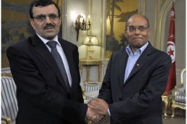 Tunisian President Moncef Marzouki (R) shakes hands with Tunisian prime minister designate Ali Larayedh on February 22, 2013, in Tunis. Larayedh, the Islamist interior minister tapped to become Tunisia's next premier, pledged to form a cabinet representing all Tunisian men and women and upholding gender equality.