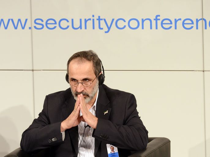 Sheikh Moaz Al-Khatib, head of the Syrian opposition, listens during the Munich Security Conference on February 1, 2013 in Munich, southern Germany. High-level officials, ministers and top military brass gathered at the Munich Security Conference Friday with Syria in the spotlight and amid a US warning to Iran over stalled nuclear talks