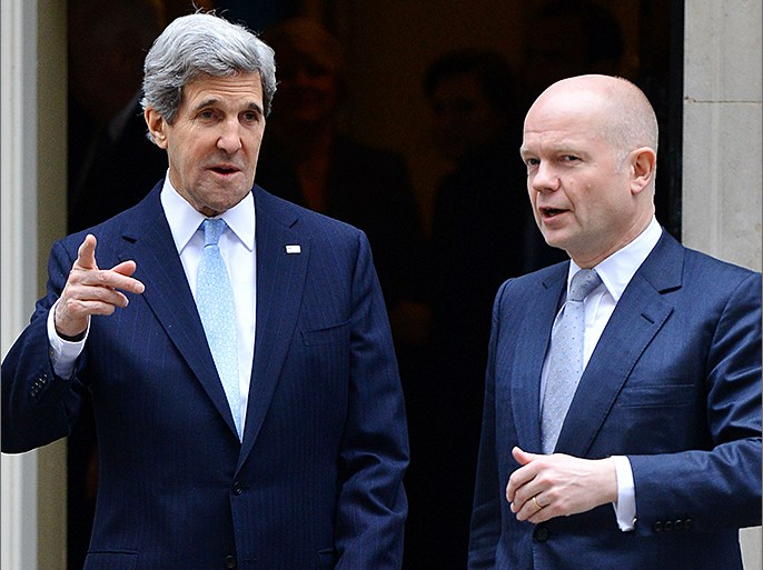 British Foreign Secretary William Hague (R) and US Secretary of State John Kerry (L) leave Downing Street in central London on February 25, 2013 after a meeting with British Prime Minister David Cameron. Kerry started a marathon tour of allies in Europe and the Middle East which will include meetings with Cameron and Foreign Secretary William Hague on February 25 and then visits to Germany, France, Italy, Turkey, Egypt, Saudi Arabia, the United Arab Emirates and Qatar. AFP PHOTO / BEN STANSALL