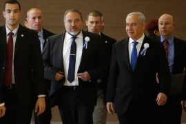 Israel's Prime Minister Benjamin Netanyahu and former foreign minister Avigdor Lieberman (3rd L) arrive to a Likud-Beitenu faction meeting at parliament in Jerusalem February 5, 2013. Israel's President Shimon Peres on Saturday formally called on Netanyahu to assemble a new coalition following the Jan. 22 general election in which Netanyahu's rightist Likud-Beitenu emerged as the biggest party. REUTERS/Baz Ratner (JERUSALEM - Tags: POLITICS)