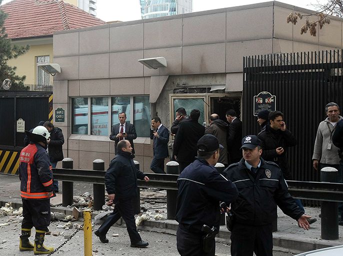 epa03563772 Turkish police secure the area after an explosion at the security entrance of US Embassy in Ankara, Turkey 01 February 2013. At least two people have been killed and two injured in an apparent suicide bombing near the US embassy in the Turkish capital Ankara Friday, Turkish media reported. EPA/STR TURKEY OUT