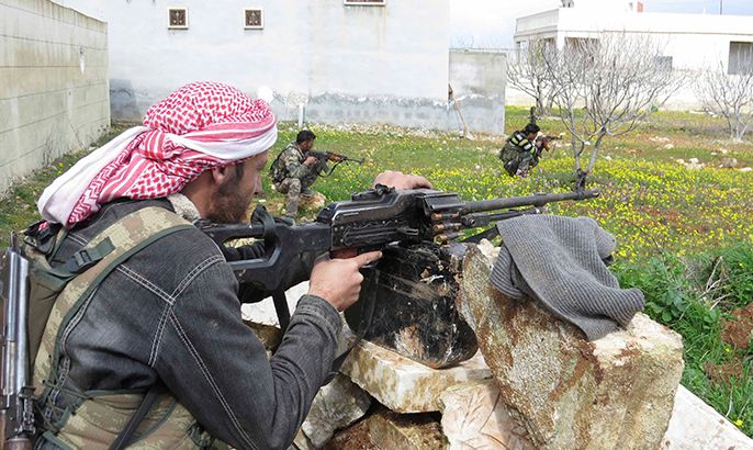 Free Syrian Army fighters hold their weapons and take positions in preparation for what they say is an ambush against forces loyal to Syria's President Bashar al-Assad in Binnish in Idlib Province February 21, 2013. Picture taken February 21, 2013. REUTERS/Mohamed Kaddoor/Shaam News Network/Handout (SYRIA - Tags: POLITICS CIVIL UNREST)