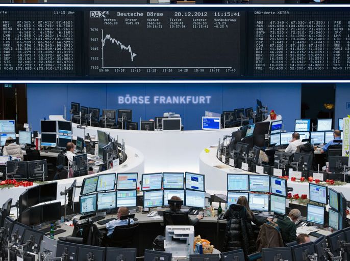 epa03519182 Market traders sit at their workplaces on the floor of the stock market in Frankfurt Main, Germany, 28 December 2012, during the last day of trading in the year, during which the DAX has drifted slightly into the minus. EPA/BORIS ROESSLER